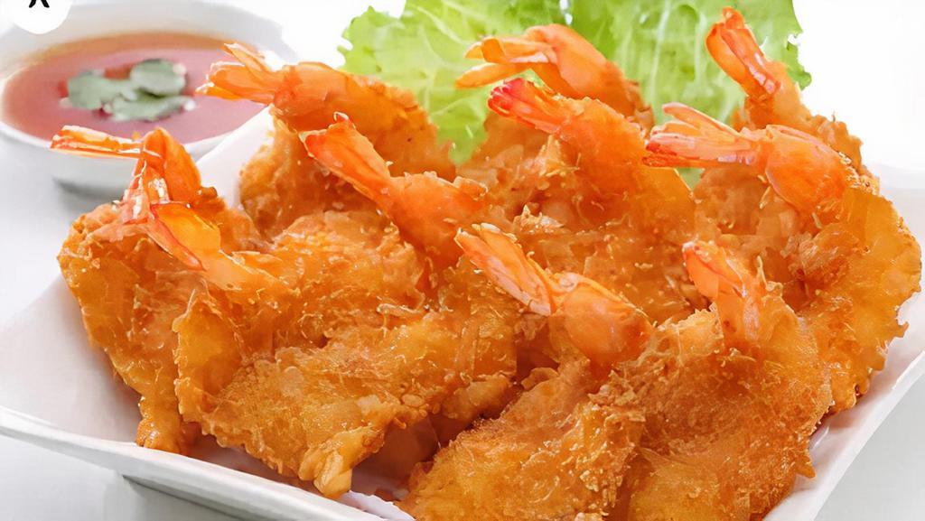 Tôm Chiên Bột · Deep-fried shrimp - Tiger Prawns fried in coconut flakes tossed with 
panto breadcrumbs, served with sweet chili sauce