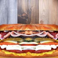 Real Madrid · Turkey Sausage, Pork Chorizo, Egg, Bacon, 
Ham, Head Cheese, Breaded Steak, Melted
Cheese, T...