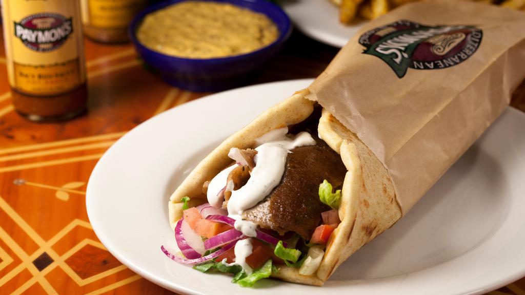 Gyros Pita · Slices of a rotisserie cooked mixture of beef and lamb, served with fresh romaine lettuce, red onions, tomatoes, and Greek tzatziki sauce.