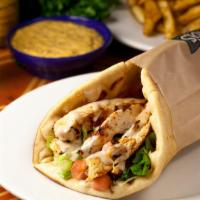 Chicken Pita · Chunks of boneless chicken breast marinated in traditional herbs, broiled, and served with l...