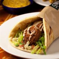 Falamus Pita · Vegan. It's our falafel pita, with creamy hummus inside. It's a great, meatless, and high pr...