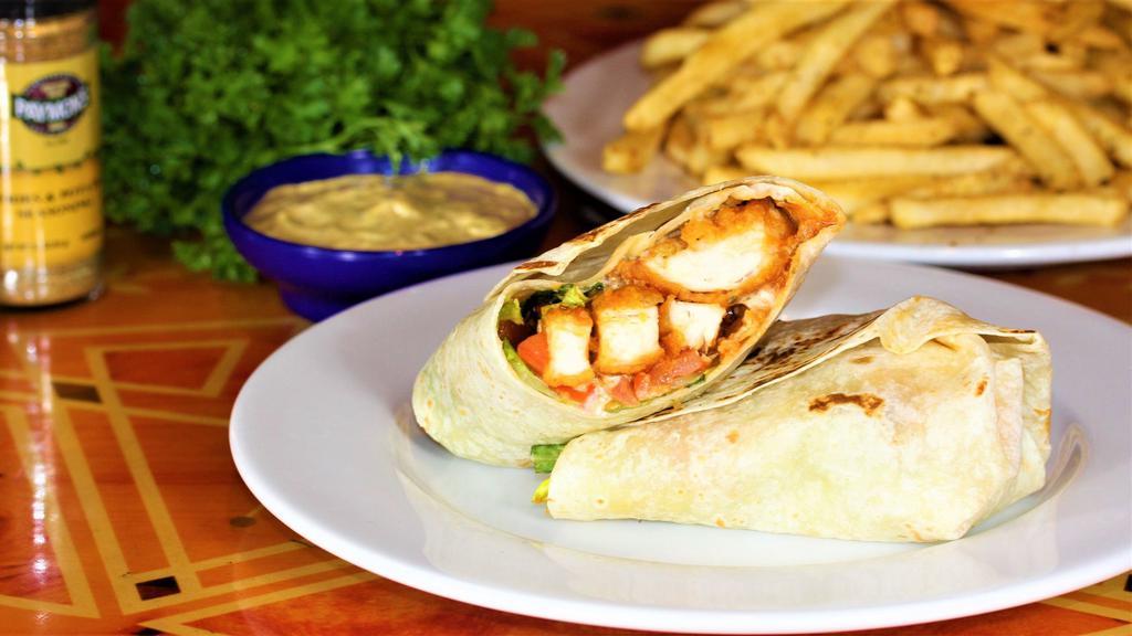 Buffalo Chicken Wrap · Your choice of grilled chicken or chicken fingers in a delicious buffalo sauce with lettuce, tomato, and house made ranch dressing in a thin tortilla wrap.
