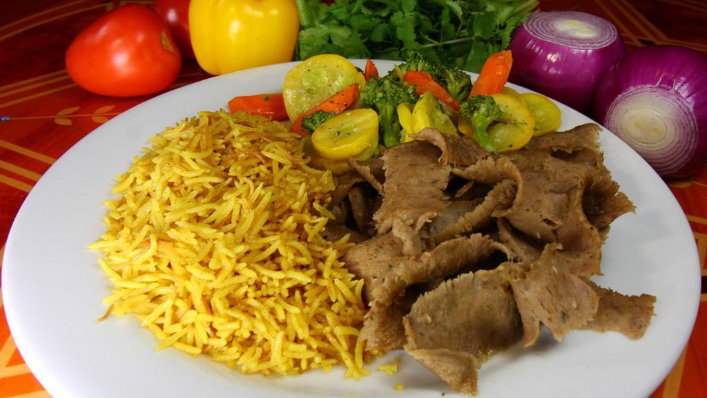 Gyros Platter · Rotisserie beef and lamb thinly sliced and served with sautéed vegetables and vermicelli pilaf.