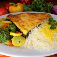Moussaka · A classic Greek dish. A layered casserole of sliced eggplant, ground chuck, onions, potato, ...