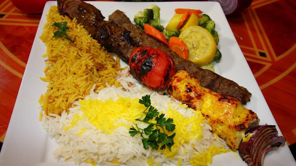 Broiled Kabob Trio · A sampling of our three most popular kabobs. Marinated chicken, lamb and koobideh (ground beef kabob). Served with basmati rice, vermicelli pilaf, sautéed vegetables, and roasted tomato.