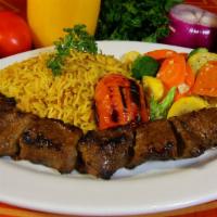 Broiled Moroccan Lamb Kabob · Top sirloin domestic lamb marinated with Moroccan seasonings and rotisserie broiled. Served ...