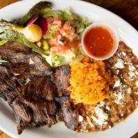 Carne Asada · Premium grilled skirt steak, grilled onions, sliced tomatoes, roasted chile toreado, pico de...