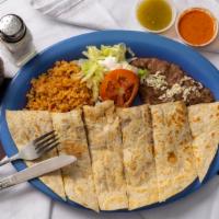 Quesadilla · Your choice of meat. Served with rice and beans.
