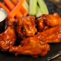 Traditional Classic · 8 classic buffalo sauce wings, served with carrots & celery and a choice of blue cheese or r...