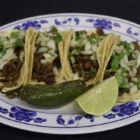 Tacos · 4 soft tacos with meat choice served with onion and cilantro