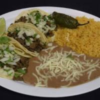 Combo Tacos · 3 soft tacos whit meat choice , onion and cilantro, served with rice and beans