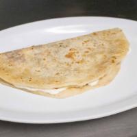 Baleada Regular · Tortilla de Harina hecha a mano, Crema, Queso Cotija y frijoles. Handmade Flour Tortilla, Cr...
