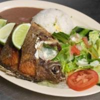 Mojarra Frita · Fried tilapia served with rice, beans and salad.