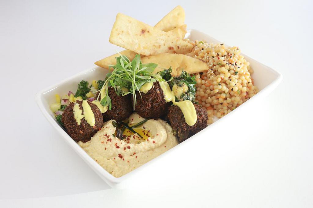 Med 5.0 · falafel, hummus, cashew caesar broccoli, spicy sesame couscous, pita strips, israeli slaw, spiced tahini (vegan, contains gluten, contains nuts, contains soy)