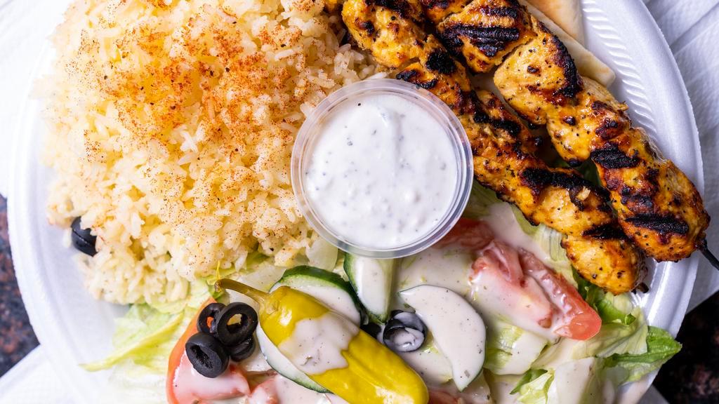 Double Chicken Kabob · Double Chicken Kabob served with Pita Bread, White Sauce, Garden Salad and your choice of Rice, Pinto Beans, or Potatoes