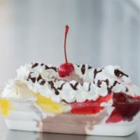 Banana Split · Whole banana, strawberry and pineapple toppings, chocolate syrup, whip cream, nuts and a che...