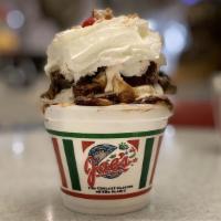 Peanut Butter Fudge · Peanut butter, hot fudge and Reese's cups, whip cream, nuts and a cherry.