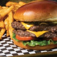 Classic Cheeseburger · Juicy 1/3 pound beef patty topped with melted American cheese and crispy veggies (lettuce, t...