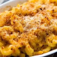 Macaroni & Cheese · Homemade with all the good stuff, real Cheddar, Romano, Parmesan, and cream.