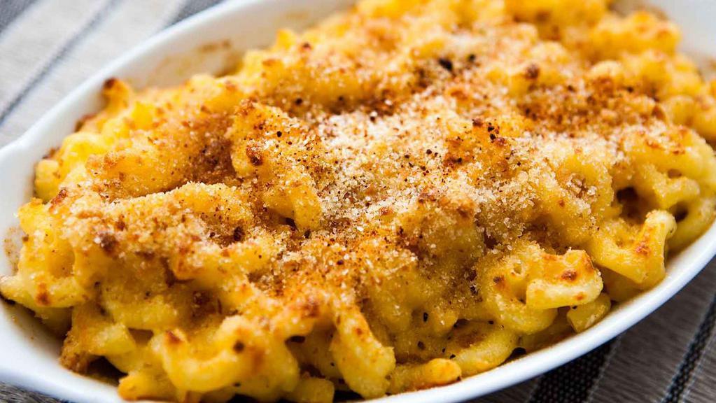 Macaroni & Cheese · Homemade with all the good stuff, real Cheddar, Romano, Parmesan, and cream.