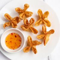 Crab Rangoon · Stuffed with cream cheese, imitation crab meat, and green onion. Served with sweet and sour ...