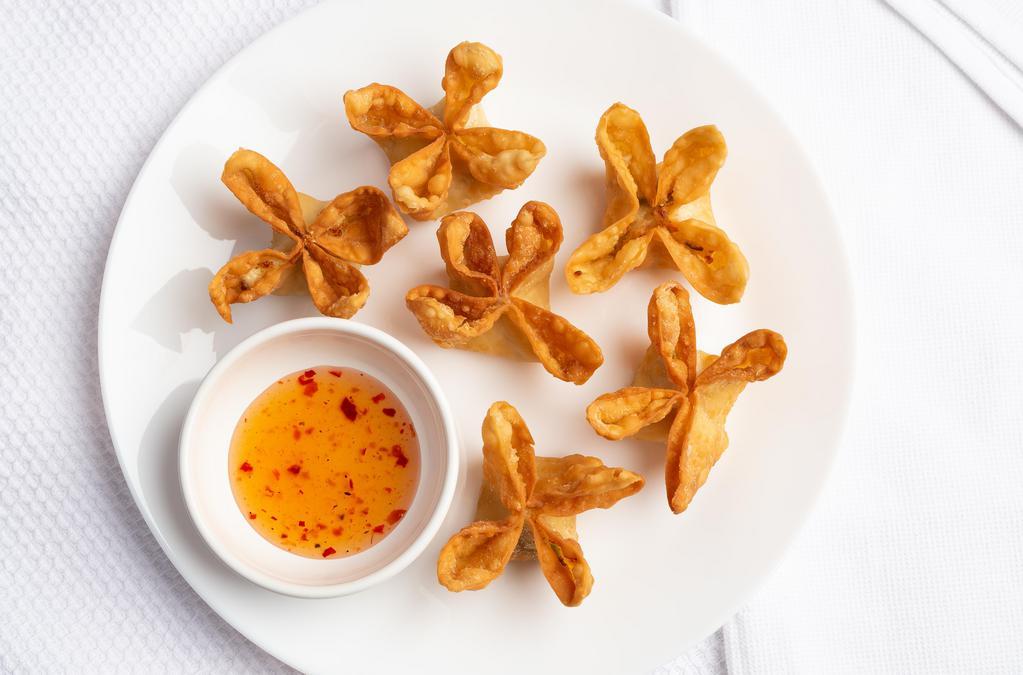 Crab Rangoon · Stuffed with cream cheese, imitation crab meat, and green onion. Served with sweet and sour sauce.
