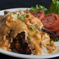 Smothered Catfish (Dinner) · Blackened catfish fillets (2) smothered with our mildly spicy crawfish cream sauce, served o...