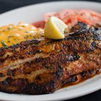 Blackened Catfish (Lunch) · Blackened catfish fillet (1), seasoned to perfection, served with tomatoes vinaigrette and M...