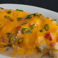 Green Chili Breakfast Burrito · Eggs, country potatoes, and pepper-jack cheese wrapped in a flour tortilla and smothered in ...