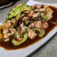 Ceviche Mixto · Cured shrimp and fish, octopus, scallops, sumerge and special sauce, tomatoes, onion, cucumb...