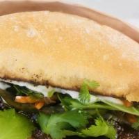 Hercules Banh Mi · Thai glazed tempeh stacked with fresh cilantro, mint, basil, house pickled cucumber and carr...