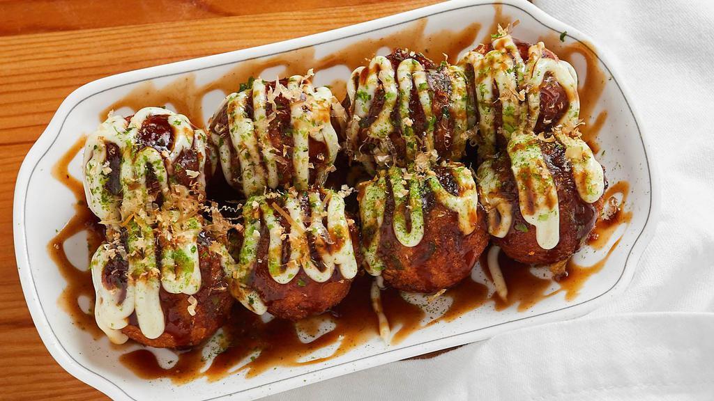 Takoyaki (7Pcs) · A ball-shaped snack made of wheat flour-based batter, minced octopus topped with takoyaki sauce, mayonnaise and bonito flakes(dried fish).