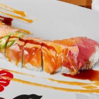 Rainbow Dragon · Crab salad, avocado, cucumber and shrimp tempura roll covered with tuna, salmon,  white tuna...