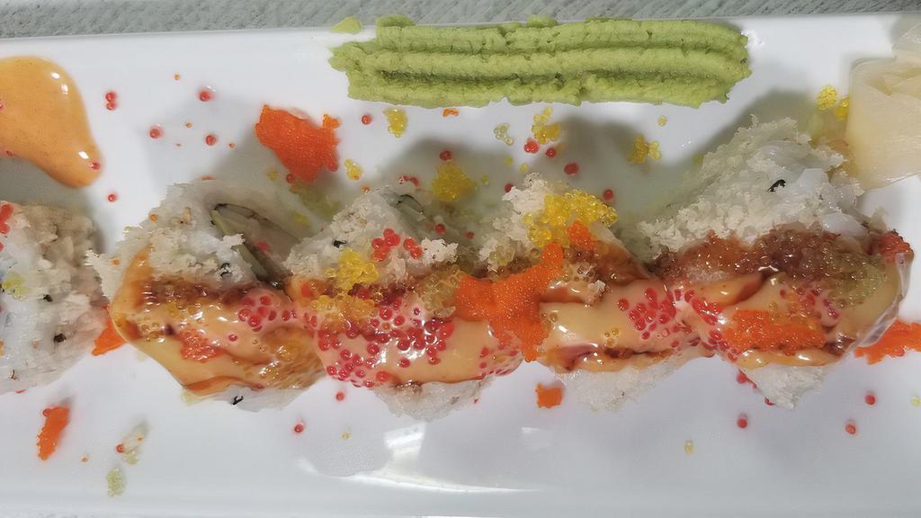 D · Shrimp tempura, eel, crab salad, cucumber, avocado covered with tempura flake, tobiko, eel sauce, honey mustard and umami sauce.