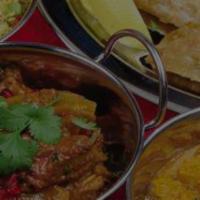 Spice Of India Thaali For 2 (Vegetarian & Non-Vegetarian) · A dinner for two includes vegetable pakora and chicken pakora, tandoori chicken, chicken tik...
