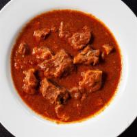 Goat Curry (Bone In) · Gluten free. Home style delicately cooked with Indian spices and herbs with onion, garlic, g...