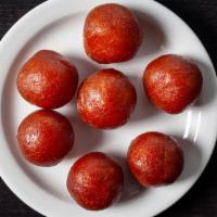 Gulab Jamun · Milk balls in rose water sugary syrup.