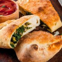 Spinach And Mozzarella Calzone · Spinach and Mozzarella cheese stuffed and folded inside Pizza Dough. Served with Marinara sa...