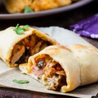 Meat Calzone · Mozzarella cheese, pepperoni, sausage and ham stuffed and folded inside Pizza Dough. Served ...