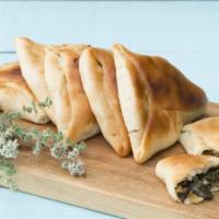 Veggie Calzone · Tomatoes, mushrooms, onions, green peppers and black olives stuffed and folded inside Pizza ...