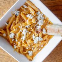 Adult Mac-N-Cheese · Penne Pasta Tossed in Spicy Parmesan
and White Cheddar Cream, Onion, Crisp Bacon, Toasted Br...