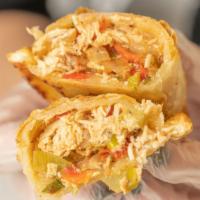 Baked Slightly Spicy Chicken Empanada · Shredded chicken breast, sautéed onions and bell peppers, scallions and parsley.