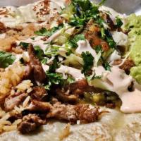 Pork Burrito · Crispy carnitas, Anaheim chile sauce, refried black and pinto beans, red rice, house salsa, ...