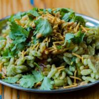 Bhel Puri · A refreshing snack of potatoes, mango, vegetables, onion, cilantro, peanuts, spices, and puf...
