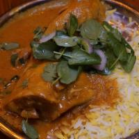 South Indian Chicken Curry · Bone-in thigh and leg in a light curry made with coconut milk, curry leaves, and coriander w...
