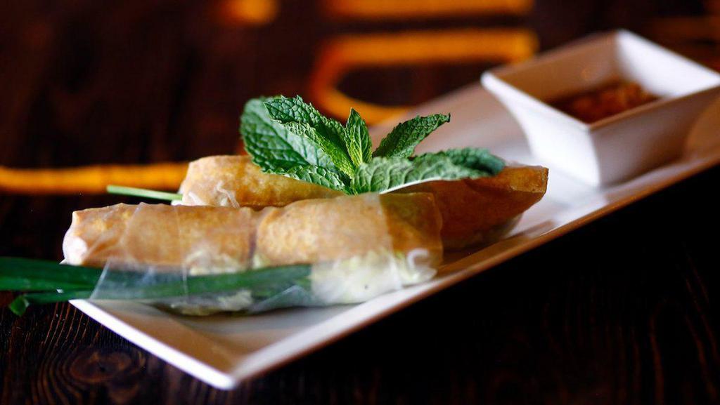 Spring Rolls Veggie · Fried tofu wrapped in rice paper with vermicelli, lettuce and mint. Served with peanut sauce. - 2pcs