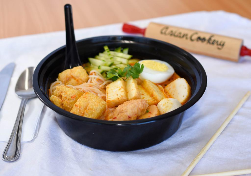 Curry Laksa Noodle · Spicy. Laksa is a popular coconut-curry soup in the Peranakan cuisine (combination of Chinese and Malay). Rice noodles, fish balls, tofu, egg and cucumber with side of sambal (spicy sauce).