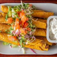 Chicken Taquitos · Eight rolled and fried taquitos with chicken, served with shredded mix lettuce, garnished wi...