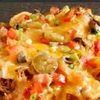 Macho Nachos · Cheddar and jack cheese melted on fried tortilla chips topped with pinto beans with jalapeno...