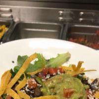 The Organic Green Mix Bowl · Mix green lettuce, black beans, queso, pico De gallo, guacamole and tortilla strips, with yo...